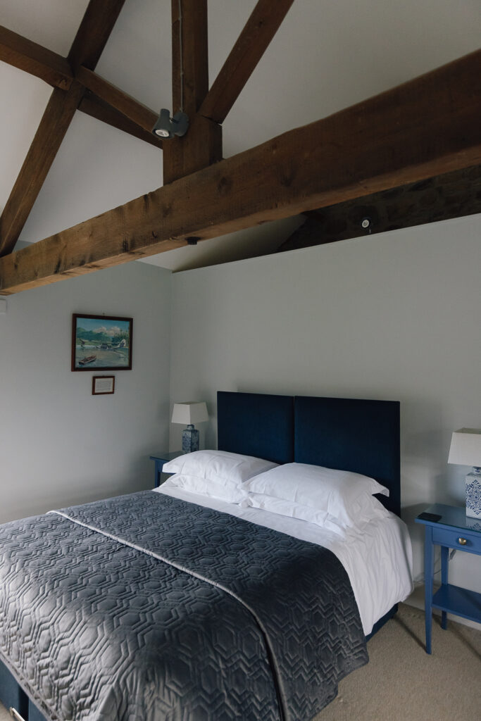 Double bed with a navy bedspread