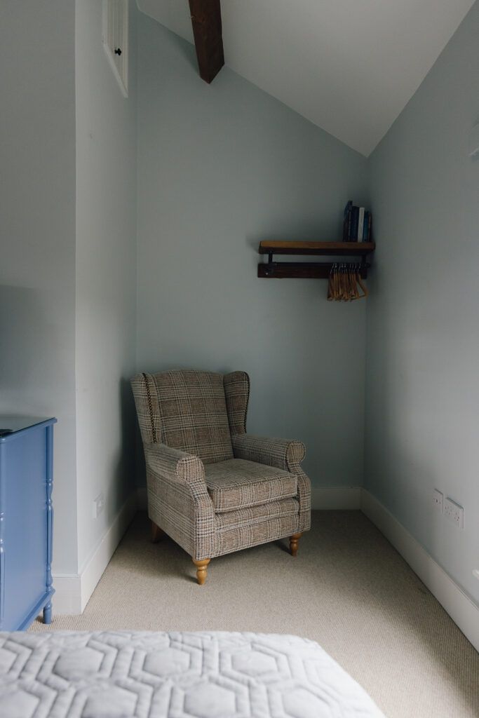 Comfortable arm chair in corner of room