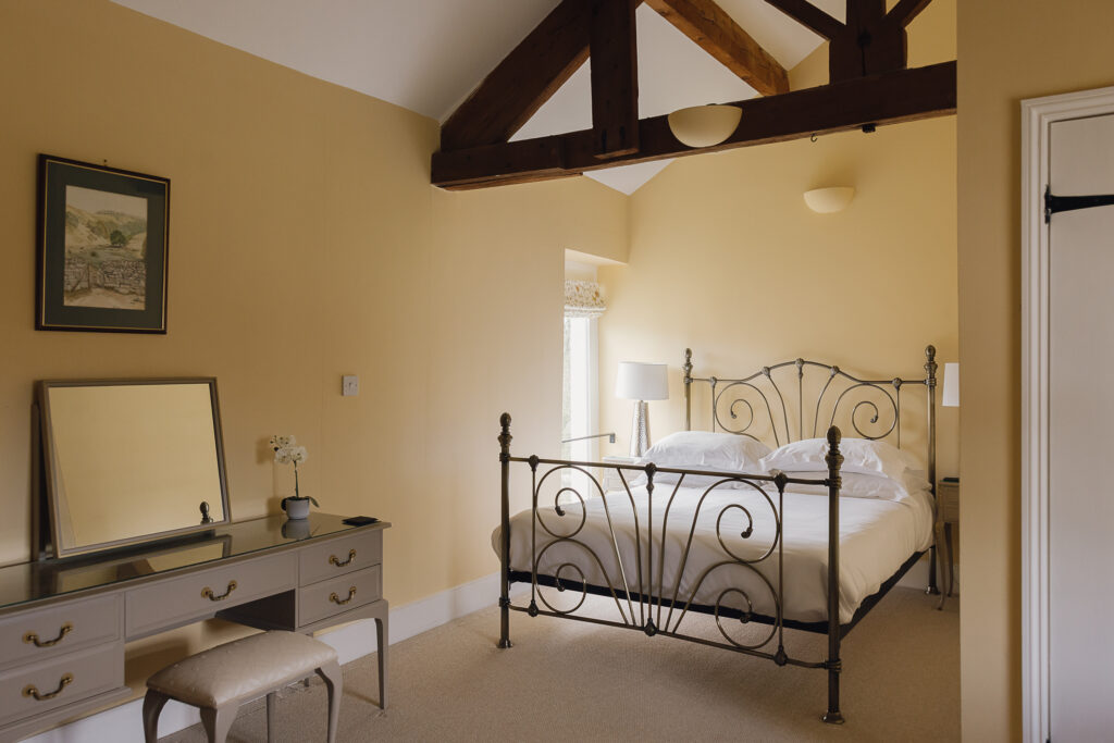 Bedroom with bed and dressing table