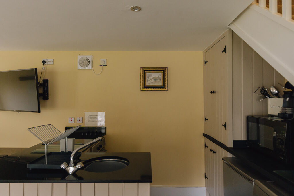 Neutral kitchen sink and cupboards