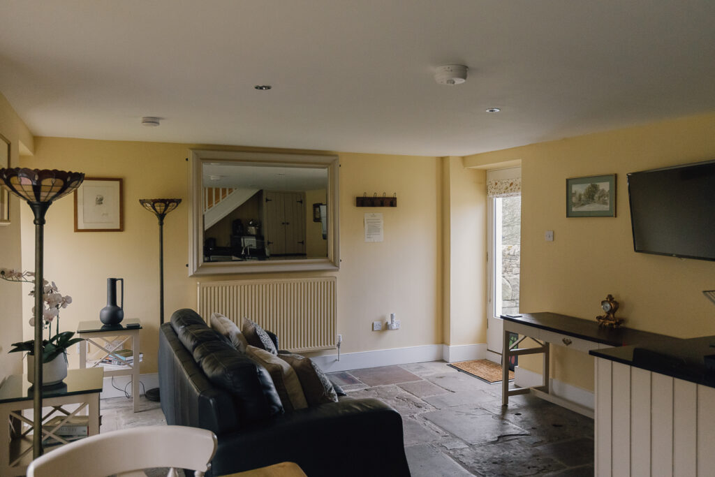 Lounge area with sofa and large mirror