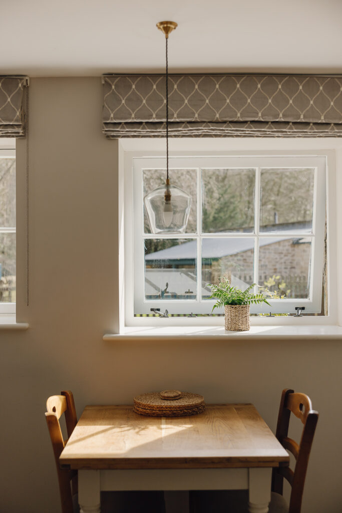 Table for two by a window letting in the light