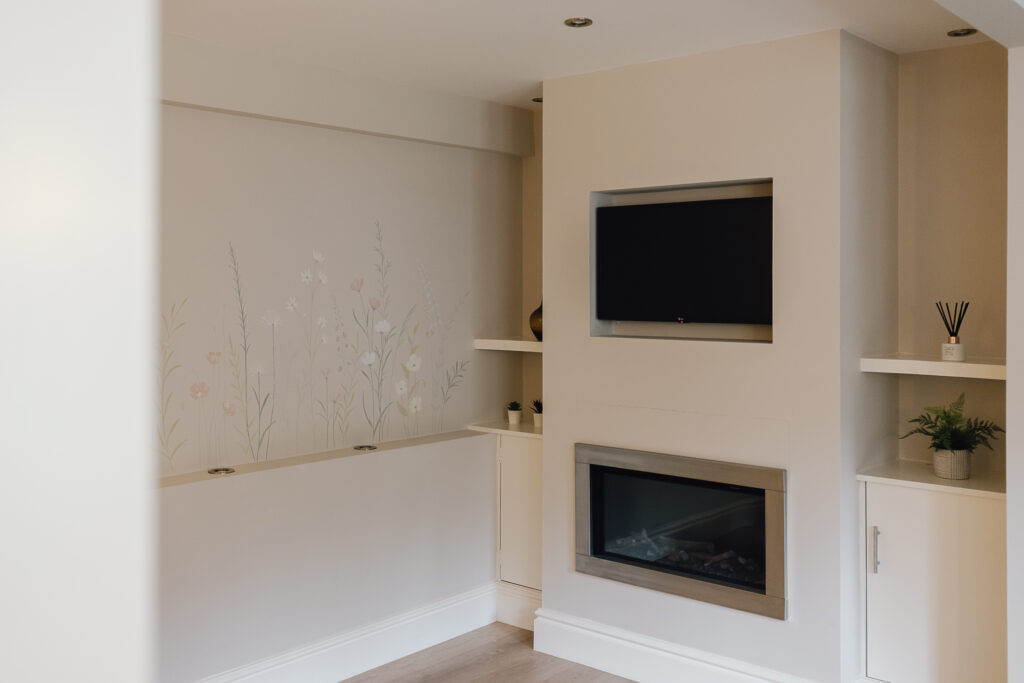 Lounge area with tv and fire