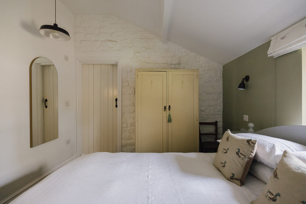 Bedroom with a a pale yellow wardrobe