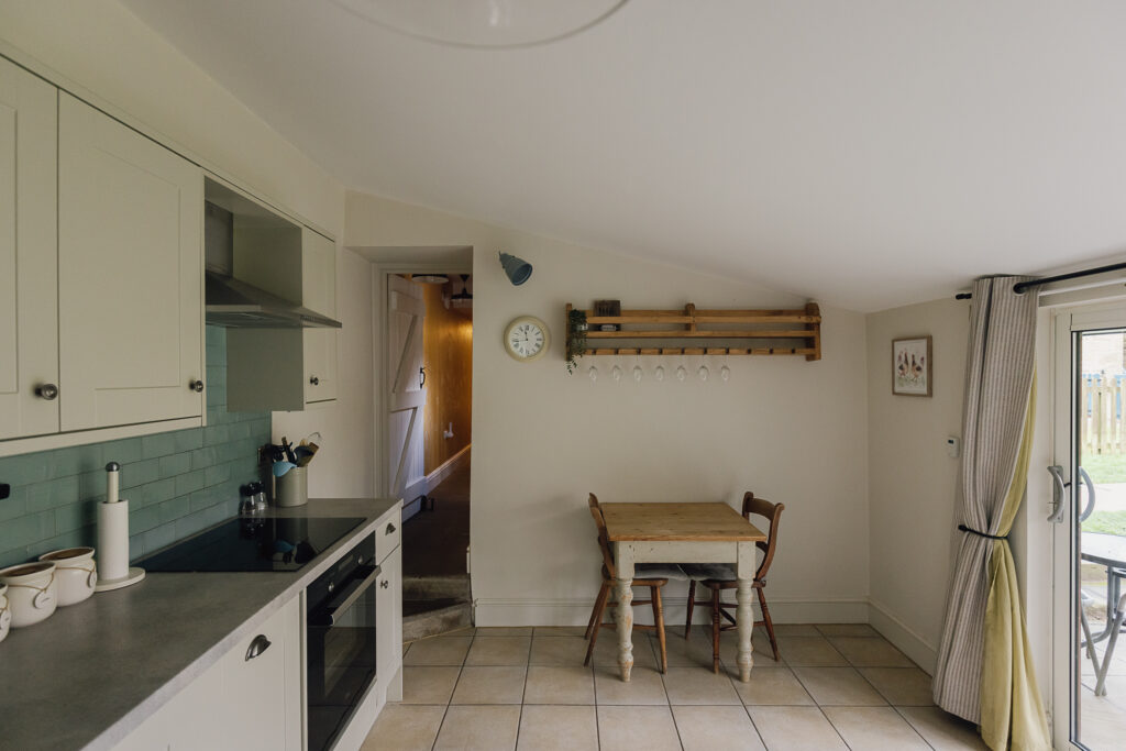 Table for two in front of a wall mounted wine glass holder