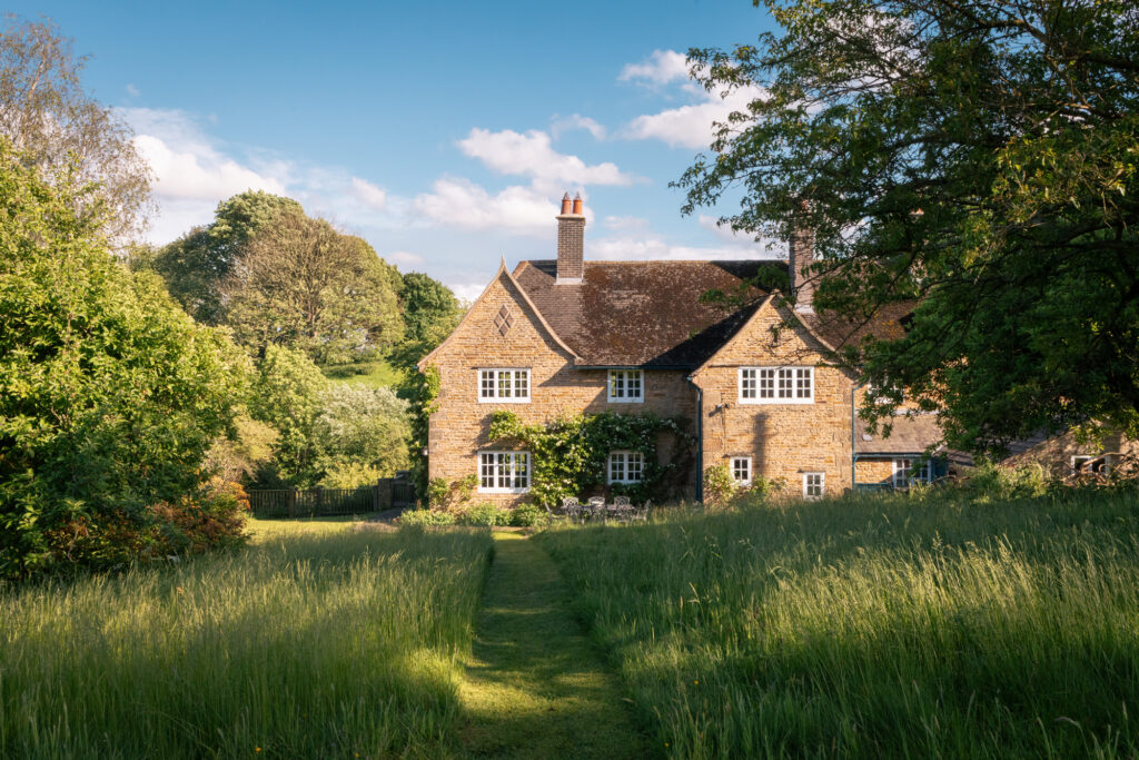 Moor View Cottage set within trees overlooking Edensor village and rolling Chatsworth parkland near Bakewell in the Peak District