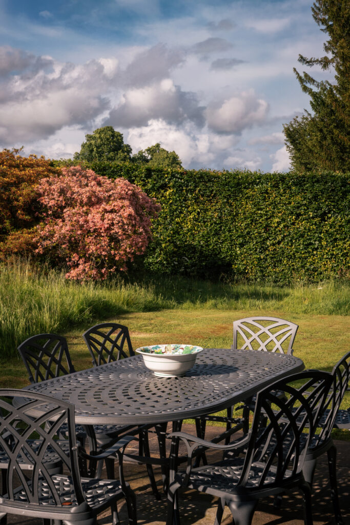 Outside area at Moorview, a table overlooking the gardens