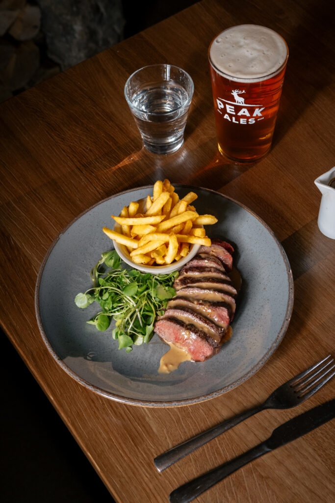 Steak and chips, with a green salad