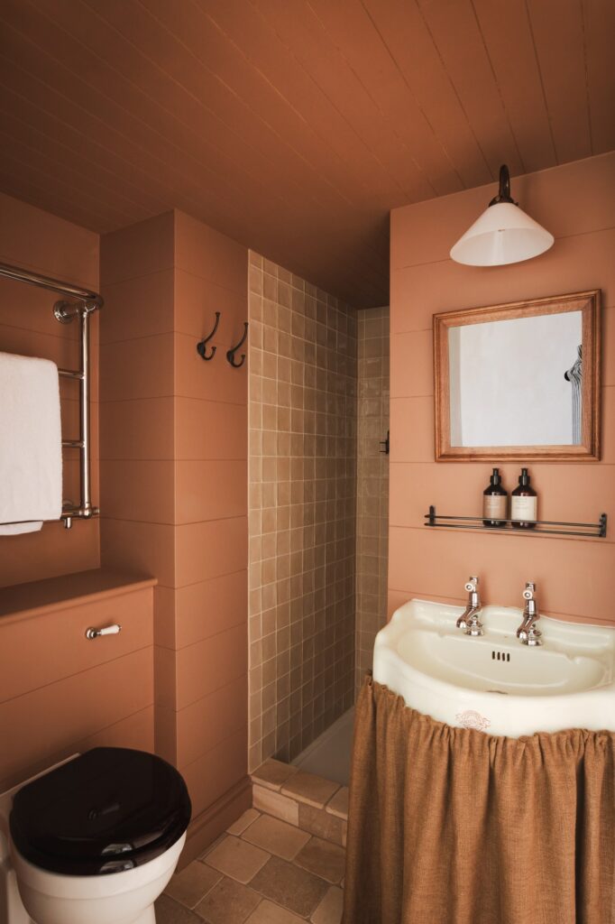 Terracotta coloured bathroom