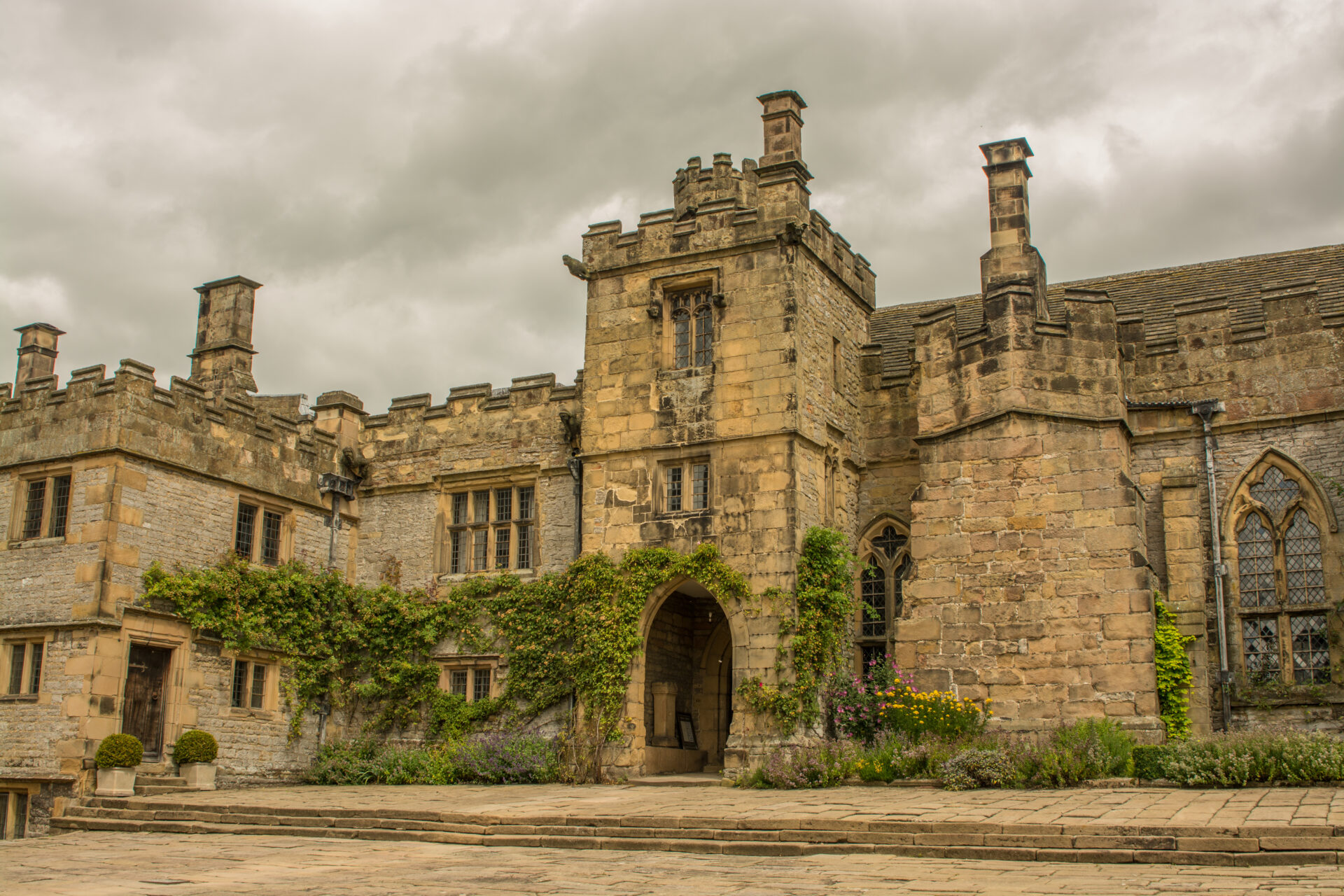 External of Haddon Hall. Stone castle with ivy
