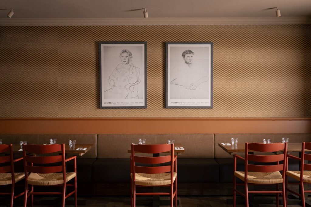 set of three tables and chairs against a wall