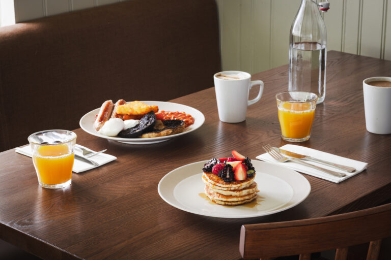 The Hide Buttermilk Pancakes with Maple Syrup and Berries and a full english breakfast, coffee and orange juice