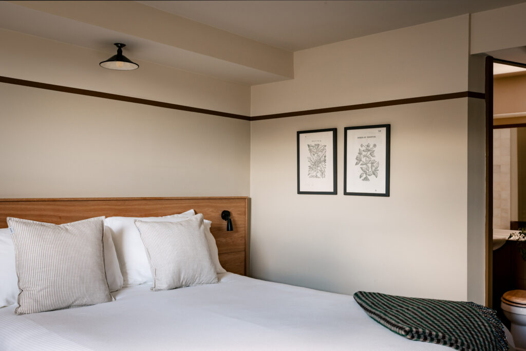 Double bed with artwork on the wall