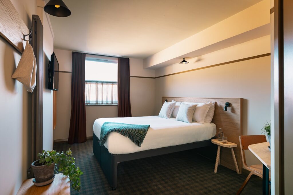 Double bedroom with blanket on bed