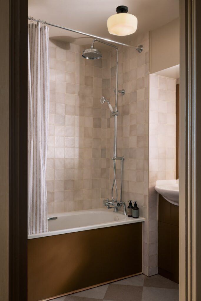 Shower room with shower over a bath