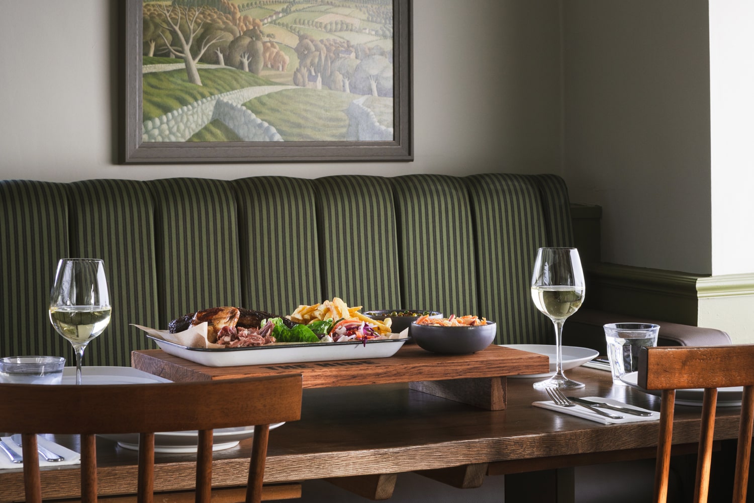 The Hide restaurant table with food and wine landscape
