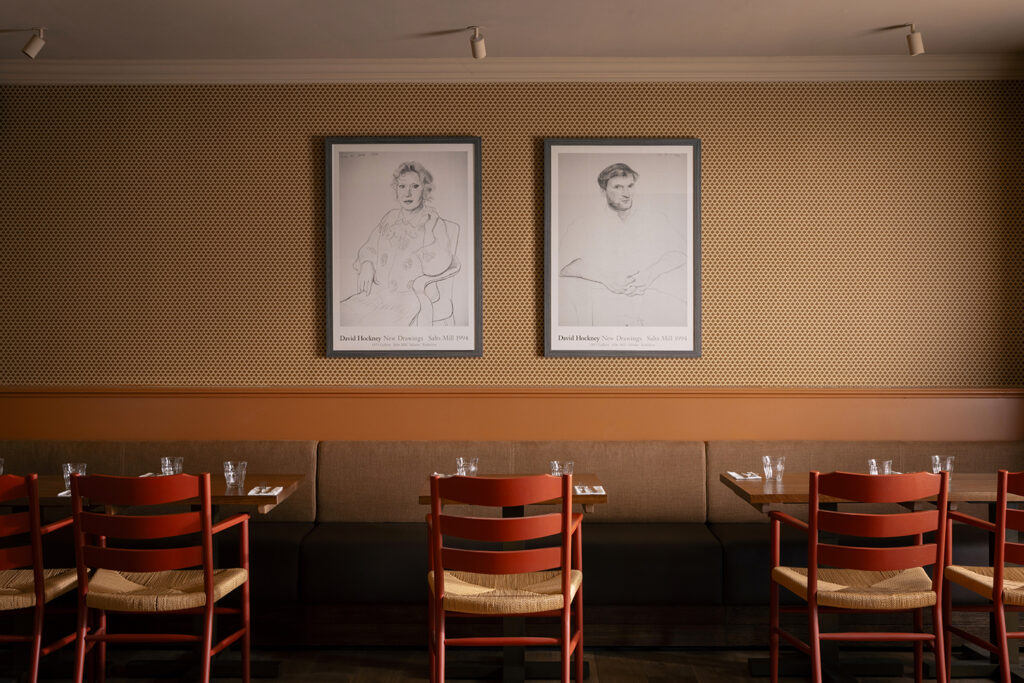 Hide restaurant with two pieces of art on the walls