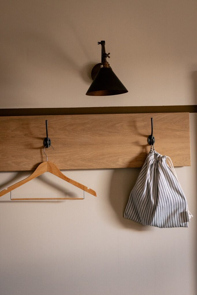 lamp, coat hanger and bag hung on a coat hook