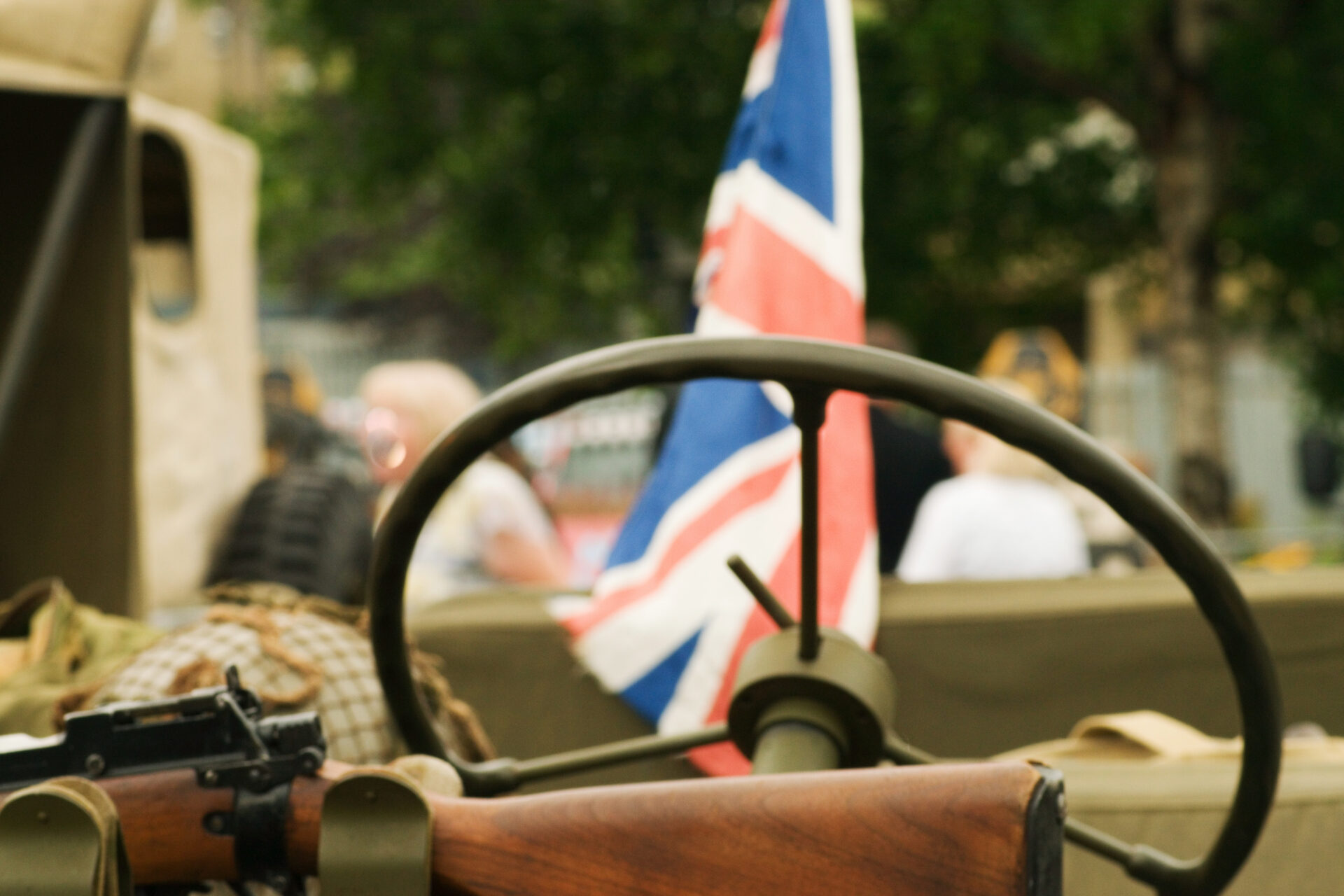 1940s weekend at peak rail. A historic union jack flag behind a war vehicle