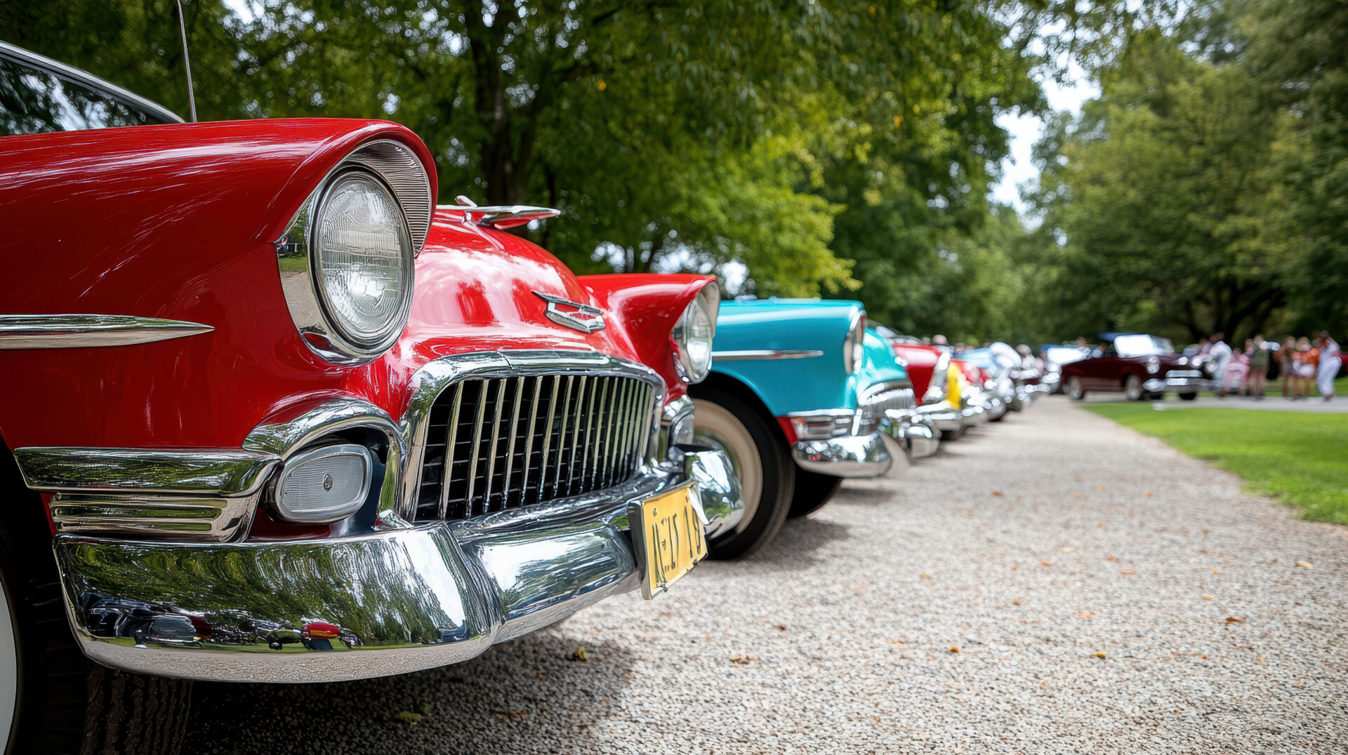 Classic vintage cars lined up at car show, showcasing vibrant colours and chrome details